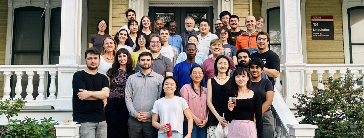 Linguistics department group photo in front of Linguistics building